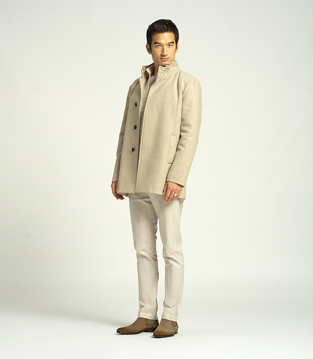 A male model stands tall wearing an all white outfit and Magnanni Shaw II boots in Torba Suede.